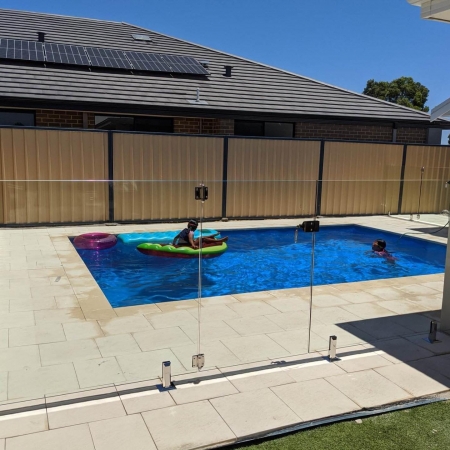 Kids safe swimming with a glass pool fence